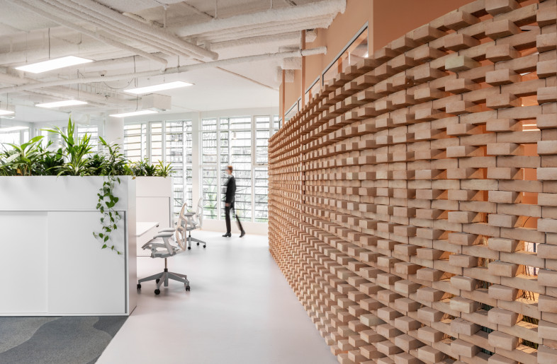 21mmeter long brick wall, produced by Stonecycle, dividing the office - is a testament to Dutch ingenuity. - Giovanni Nardi