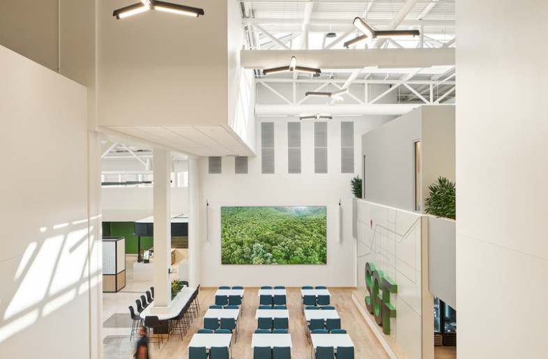 The flooring and display placement was purposely chosen to define and maximize the space for all hands meetings. - Ryan Gobuty