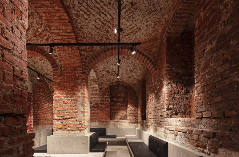 historic brick, black 3-phase rail, polished and sealed concrete, red marble, black leather, - Kim Fohmann