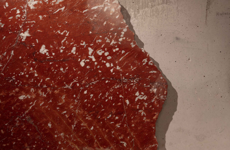 Red marble with broken edge untreated concrete, steel pins as coat rack hooks - Kim Fohmann