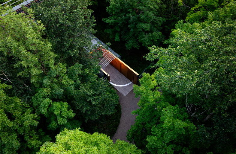 Each morning, the pivoting access door swings open and seamlessly embeds into the vertical west wall, inviting visitors to experience the site's spirit and poetry. - Loïc Lefebvre