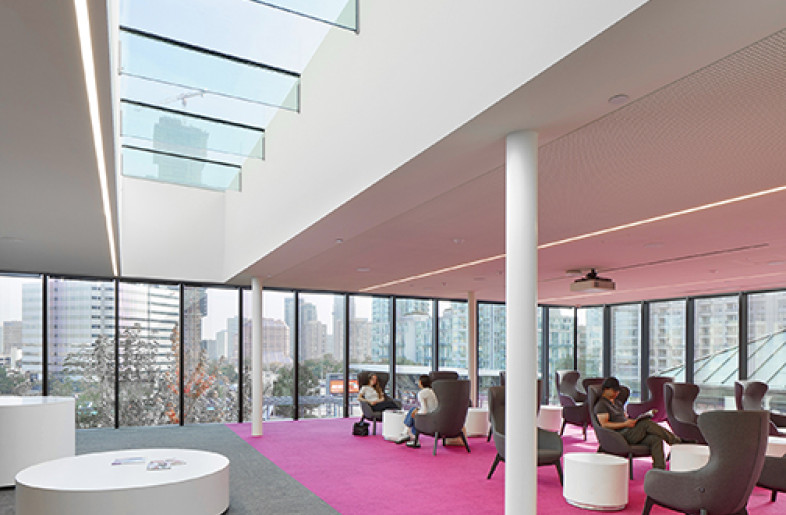 The glazing of the addition is treated with a frit pattern of vertical striations that gradually taper in width, improving bird safety and minimizing heat gain with a distinct contemporary design feature. - Tom Arban