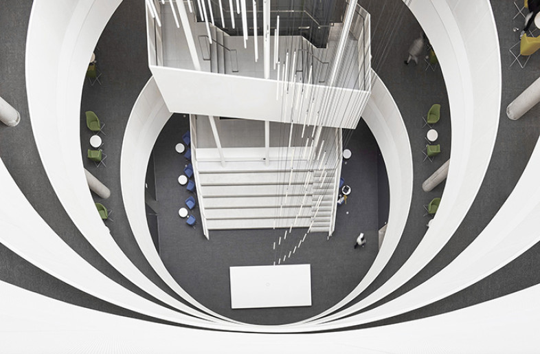 The different colours of furniture on each level corresponds to a colour-themed wayfinding strategy for each floor, simplifying navigation from the atrium and throughout the building. - Tom Arban