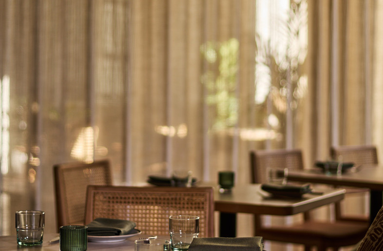 Flexible dining space with sheer curtain - Alec Bruce-Mason