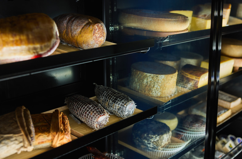 Blackened steel detailing - Curated zone for charcuterie  and cheese - Steven Woodburn