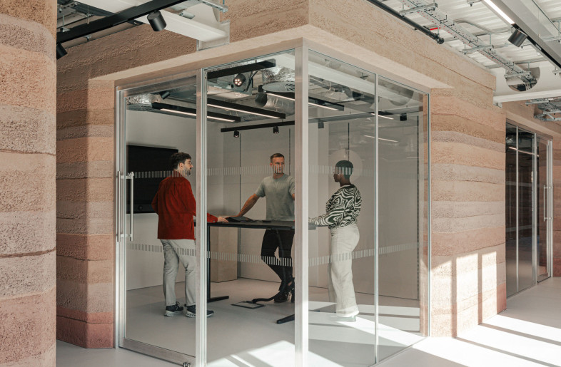 Meeting rooms feature bevelled edges, inspired by Le Corbusier, to maximise natural light and create a softer spatial experience. - Chris Wharton