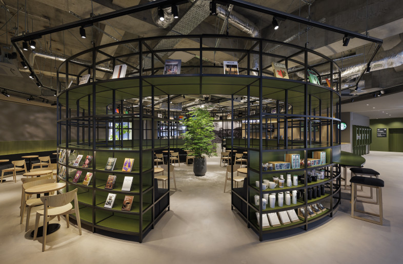 A cylindrical, sightline-friendly volume was constructed concentrically with the existing architecture. We created the area for lingering both inside and outside the café by introducing a fluid boundary between interior and exterior, guiding the flow of people through the entrance. - Nacása & Partners Inc.