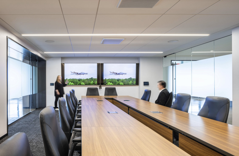 An executive conference room combines clean modern design with integrated technology, offering a polished space for meetings and multimedia presentations. - Evan Thomas/studiothomas