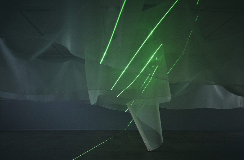 A single beam of light is projected onto layers of textile, appearing as lines with multiple and diverse expressions. - Masaki Ogawa