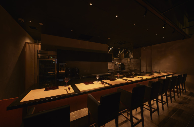 Interior View of the Meat Kappo. A glimpse into the sophisticated and focused atmosphere within the meat kappo dining area. - Photographer Shinsui Ohara