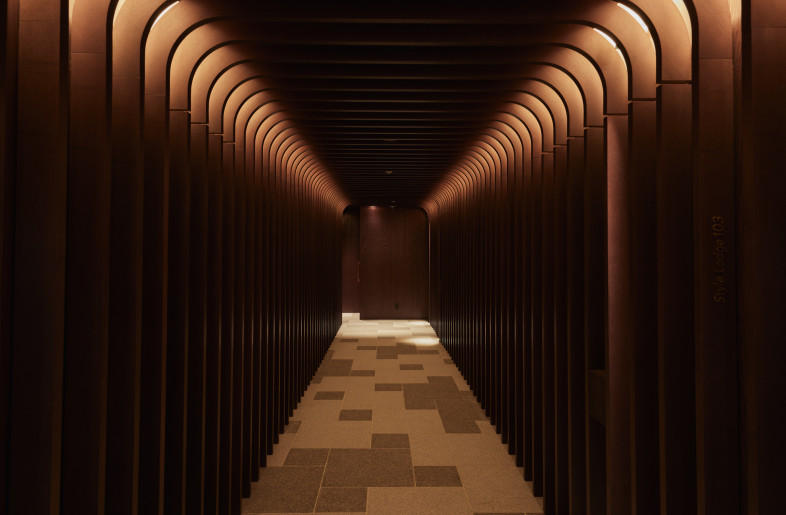 The Birch Forest at Night Leading to Private Rooms. The corridor to the private dining area is designed to evoke the serene beauty of a birch tree-lined avenue under the night sky. - Photographer Shinsui Ohara