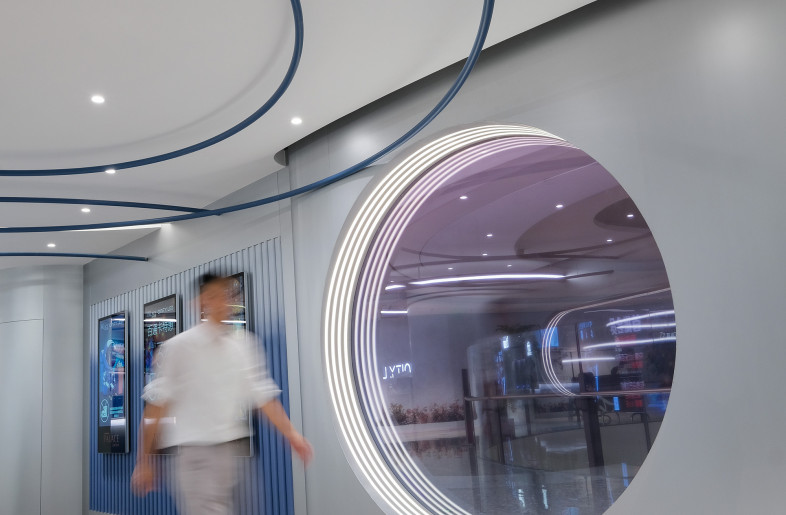 The facade's unique Dawnlight Glass creates a "check-in spot" that also serves as a window into another dimension, inviting people to take a glimpse. - Design Action