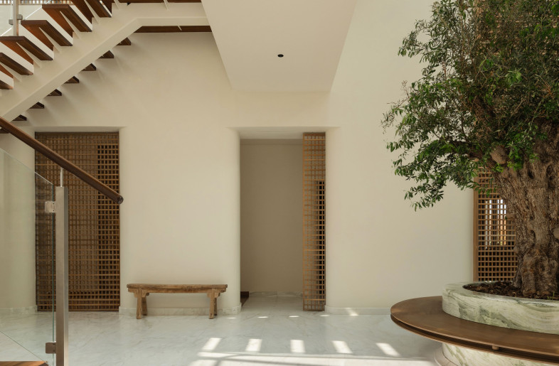 The courtyard’s airy breathing void is rooted in the middle of the home as the main growing and connecting element that branches out to all floors. - Natelee Cocks