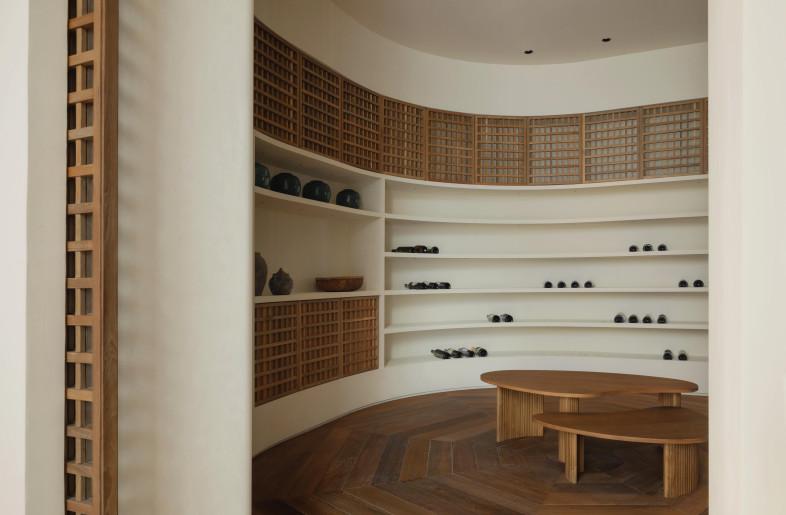 Adopted throughout the residence, the curved language of The Cellar accommodates and creates fluidity within the circulation, with the space’s dual entrance to the main area and kitchen. - Natelee Cocks