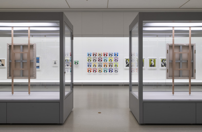 KYNE's past works housed in the museum's glass cases. - Hiroshi Mizusaki
