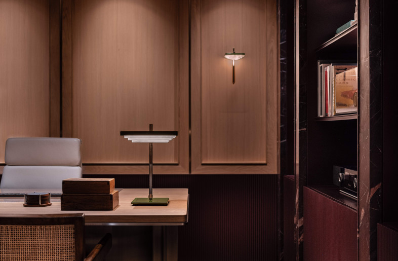 Bespoke, powder coated alabaster wall and desk lights. The translucent stone diffuses crisp yet ambient light for focused work. - Dennis Lo