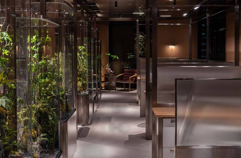 Stainless steel reflects diffused natural light throughout common areas, while fluted glass panels balance privacy and transparency. - Dennis Lo