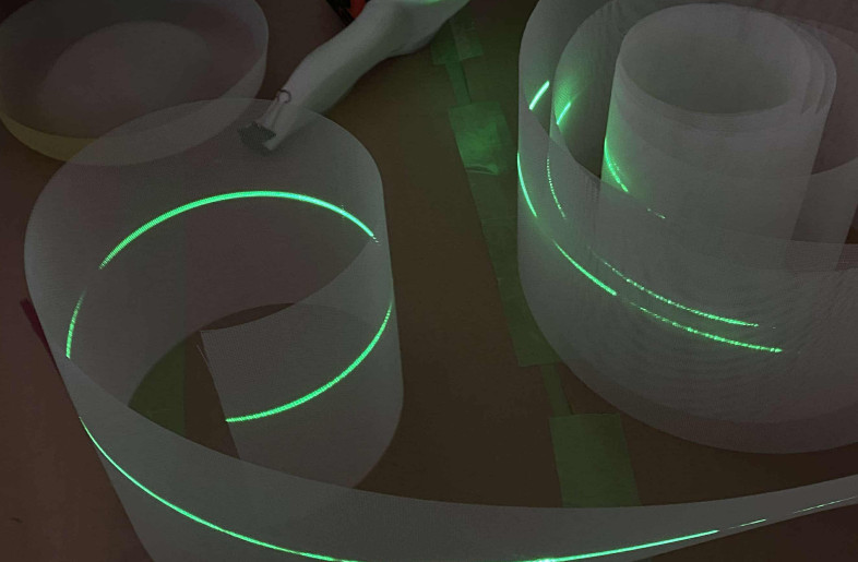 An experiment to test the expression of light produced by laser beams emitted from a common laser line generator and projected or dropped onto textiles. - TAKT PROJECT