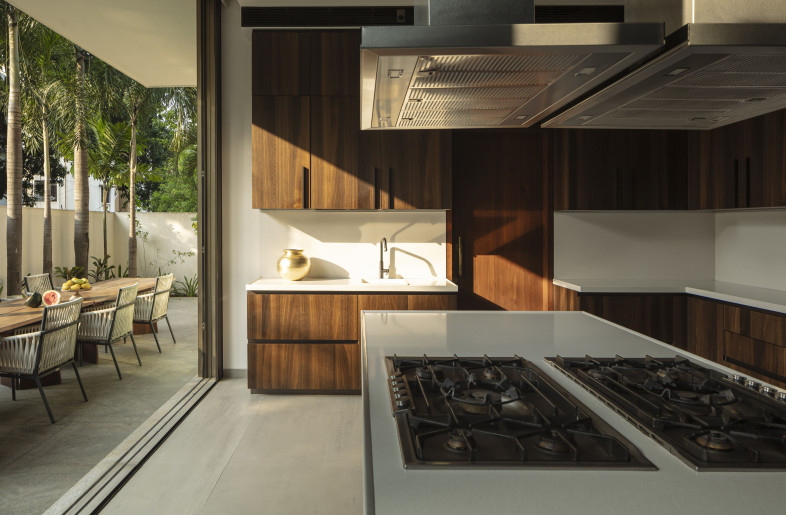 Kitchen with spilled out dining spaces on dining areas - NIVEDITAA GUPTA