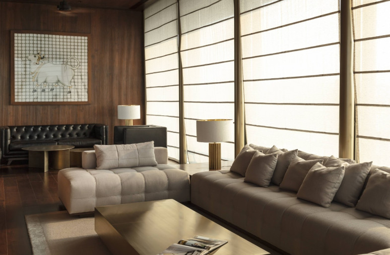 The solid hued upholstery along with brass accents brings a subtle and subdued sophistication to living areas - NIVEDITAA GUPTA