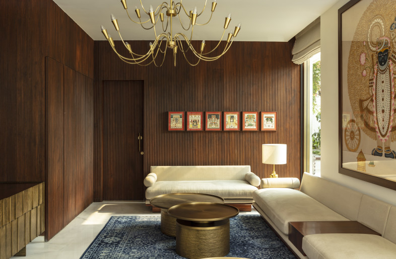 Traditional pichwai paintings displayed on recycled burma teak wood panels on walls - NIVEDITAA GUPTA