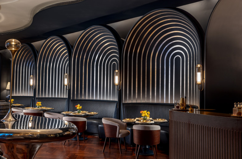 To one side of the central table, arched blue dining pods offer intimate enclaves for diners. - Jeetin Sharma