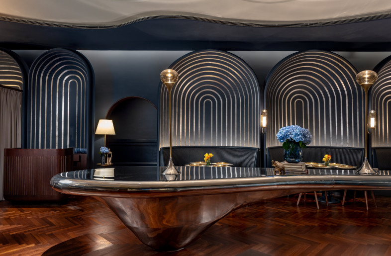 A polyrythmic layering of elements such as complementary colour palettes, fluid forms, and dynamic lighting redefines materiality, creating a space that captivates and surprises. - Jeetin Sharma