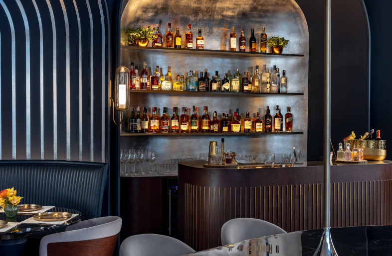The bar is rendered in metallic leaf work with a discreet server’s station. - Jeetin Sharma
