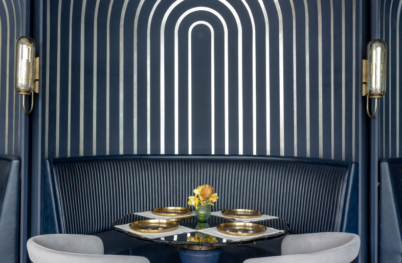 The blue arched pods, with radiating lines of metal foil, curve gracefully around custom-designed tables that explore the theme of memory. - Jeetin Sharma