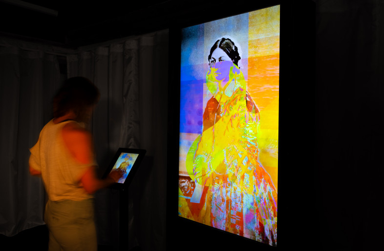 A visitor leaves feedback on the AI-powered ‘Living Portrait’ interactive, prompting Nightingale’s portrait to visually transform in response to their input. - Angus MacKinnon