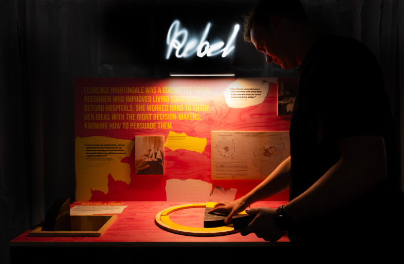 Emulating Nightingale’s pioneering work as a statistician, a visitor constructs a coxcomb diagram using data provided on the panel. - Angus MacKinnon