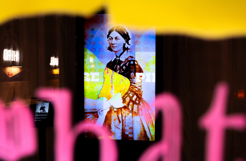 Nightingale’s digital portrait seen through one of the acrylic motif screens, merging historical identity with contemporary interpretation. - Angus MacKinnon