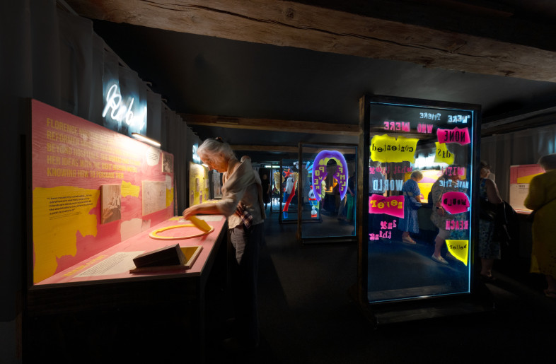 A local visitor engages with the coxcomb diagram interactive. The photo, taken from the far end of the room, captures the layout of the space. - Angus MacKinnon