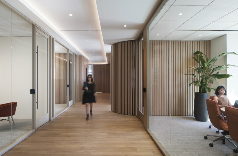 Visual interest is strategically incorporated, with focal points at each end of a long corridor to guide circulation and enhance user experience - Andrea Calo