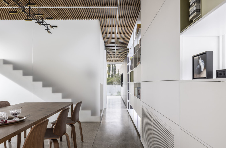 This configuration enables seamless circulation between the kitchen and family area on one side, and the dining and living areas on the other. - Amit Geron