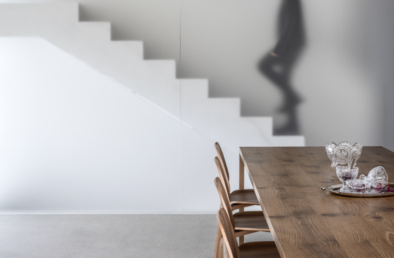The staircase inside the cube, visible through the glass, becomes a dynamic visual element. Its outline contributes motion and depth, turning it into an almost cinematic frame — reminiscent of video art. - Amit Geron