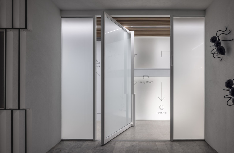 At night, lighting transforms the structure into a glowing, minimalist focal point anchoring the home. - Amit Geron