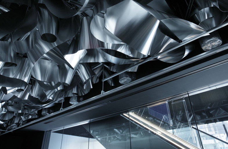 The aluminium reflects variations in the natural light, linking the interior of the office to the rhythms of the sun and the seasons. - Daisuke Shima