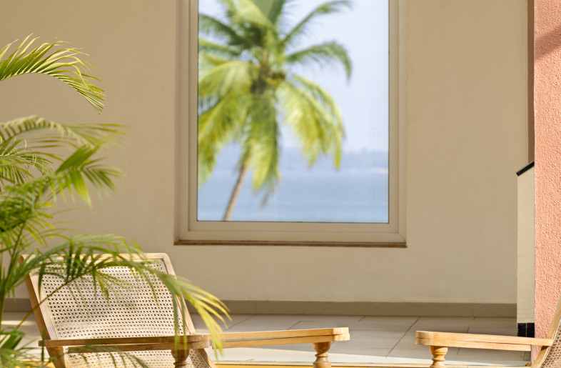 Relaxed vibe created at the reading lounge - an extension of the lobby. Here guests interact with an internal courtyard. Finishes evolve here,  to being more lime washed wood, and tropical prints. - Andre Fanthome (Studio Noughts and Crosses)