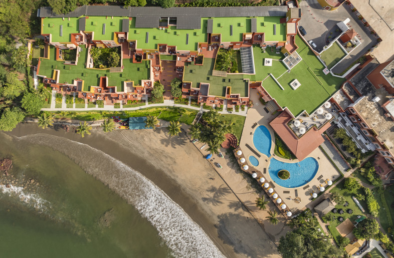 A top view of the property in context with the sea - Andre Fanthome (Studio Noughts and Crosses)