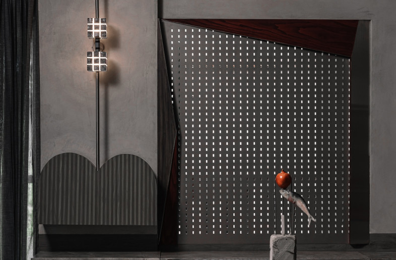Oxidised brass over dining and blackened bronze sconces mark specific moments, forming a material palette that reinforces purposeful restraint. - Ishita Sitwala