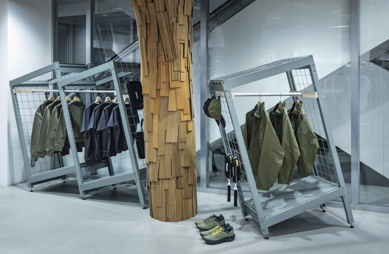 In SS24, at DOVER STREET MARKET GINZA, ready-made steel racks were repurposed into garment fixtures. The added wire mesh on the top and sides gives it the appearance of a sports locker, while allowing in light and securing the volume of products to be hung and displayed. - Kenta Hasegawa