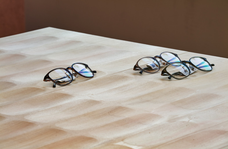 The main display fixtures feature hinoki wood tops, milled and veneered to evoke the traditional Naguri carving pattern—a subtle yet deliberate reference to Japanese craftsmanship that enriches the tactile and visual experience. - Daici Ano