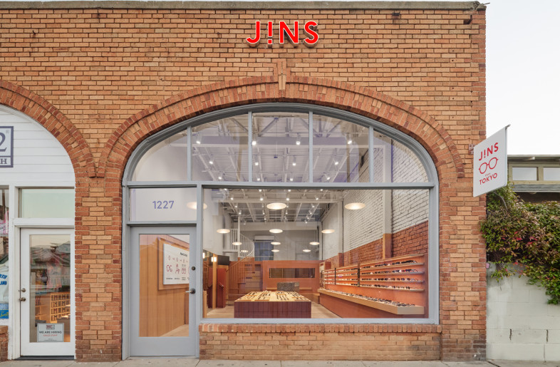 The store’s arched brick façade frames a refined interior inspired by traditional Japanese spatial sensibilities. - Daici Ano