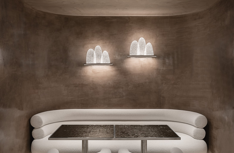 Corner of the bistro with Voluptas chairs and sofa,  Parade wall lamp all designed by Studiopepe for Visionnaire - Max Zambelli