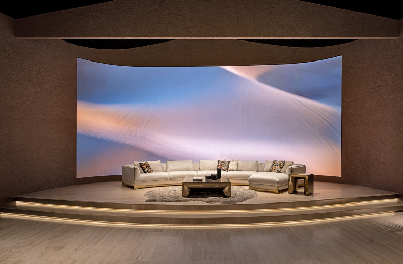 A large curved led wall has replaced the old cinema screen in the spacious stalls that serve as a showroom for the Visionnaire furniture collection - Max Zambelli