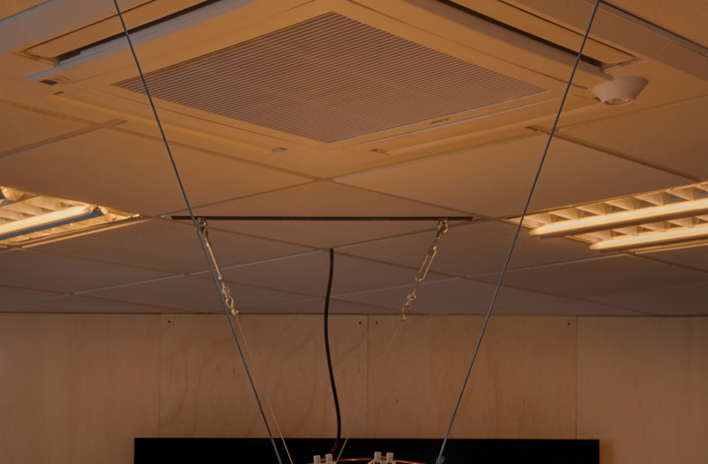 More than 100 fluorescent tubes were transformed into a horizontal suspended lamp in the meeting room. Lucas cleaned and reused the old tubes to create a simple and functional centrepiece, using only threaded rods, nuts, quick-connect clamps, and a central aluminium axis that also serves as a heat sink for the LEDs. - Asier Rua