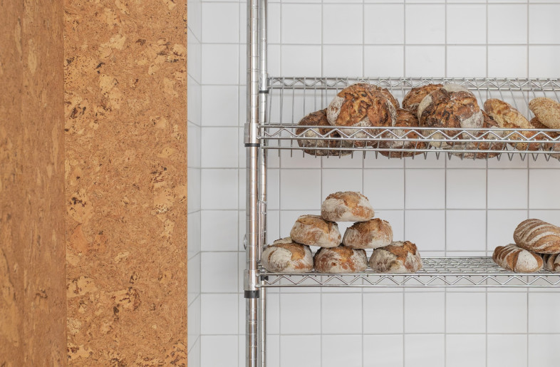 The warm orange-brown of the shop matches the colour of bread crust. - Emmy Martens