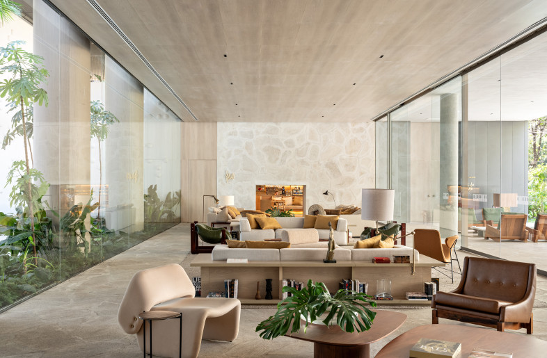 Surrounded by external and internal gardens, the Hotel lobby functions as a vibrant social hub rather than a traditional reception. The furniture includes designs by Brazilians Jorge Zalszupin, Sérgio Rodrigues, and Carlos Motta, as well as Arthur Casas. - Fran Parente
