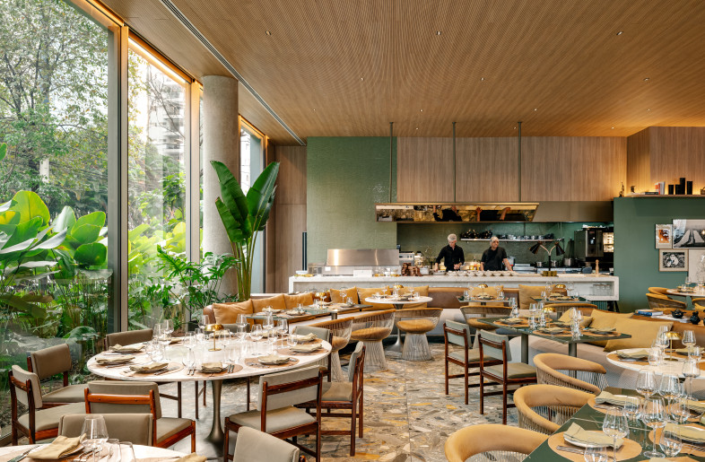 BISTRÔ CHARLÔ at PULSO HOTEL | Offering a French menu enriched with Brazilian influences, the restaurant is framed by large glazed openings overlooking the outdoor garden. The interiors combine green lacquer, ceramic tiles, wooden surfaces, and stone shard flooring. - Fran Parente